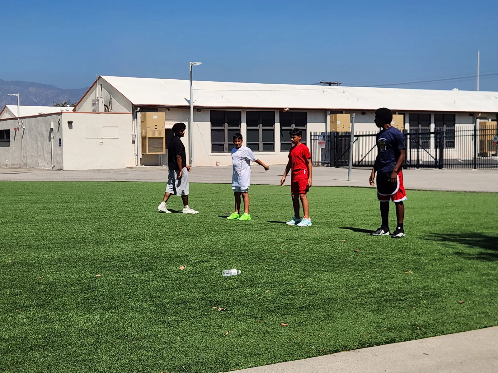 Morgan working with athletes on the training field